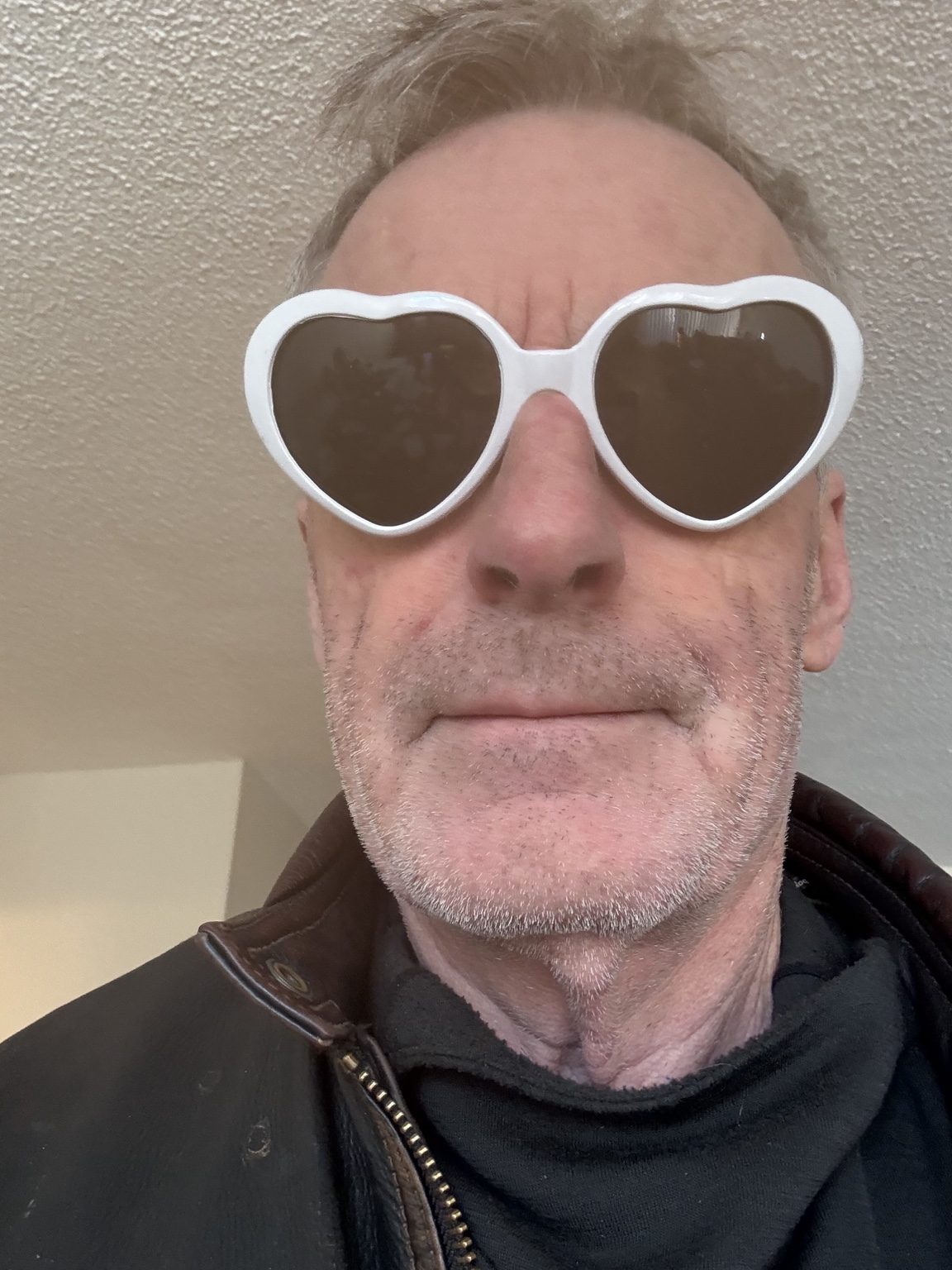 Thomas wearing white glasses